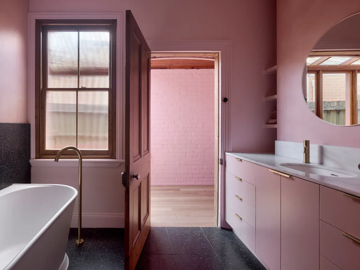 Finsbury Street bathroom with freestanding bath, reeded glass window and black terrazzo floor