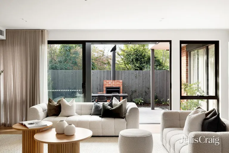 Glen Iris living room opening to alfresco courtyard