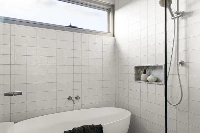 Glen Iris bathroom with freestanding bath and tiled walls